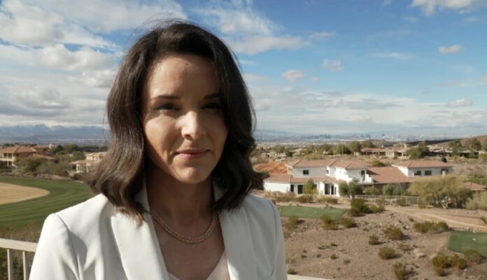 Sam Brown wife Amy Brown in a white suit